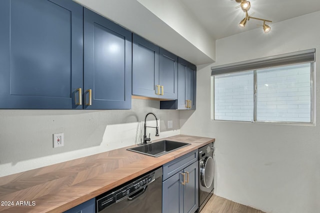 kitchen with wooden counters, stainless steel dishwasher, blue cabinets, sink, and washer / clothes dryer