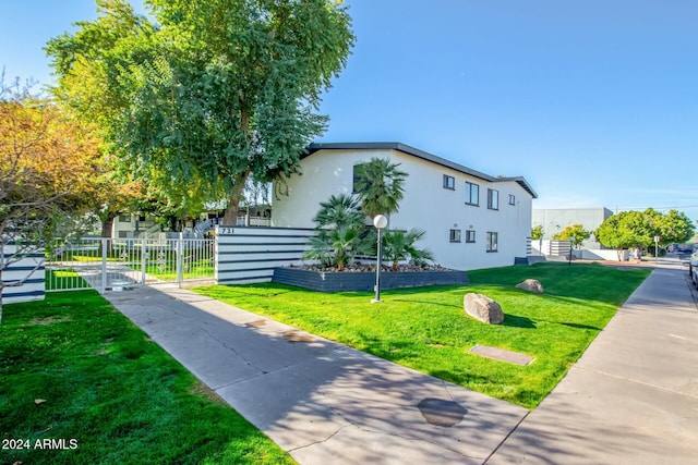 view of home's exterior featuring a lawn