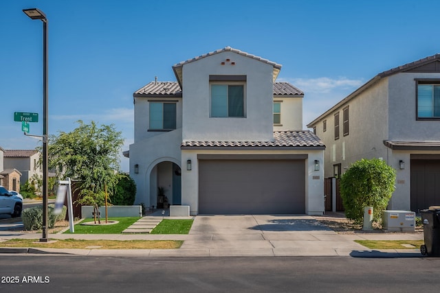 10035 E Trent Ave, Mesa, AZ 85212 - mediterranean / spanish house featuring a tile roof, stucco siding, an attached garage, and driveway