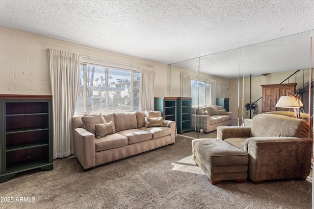 carpeted living room with a textured ceiling