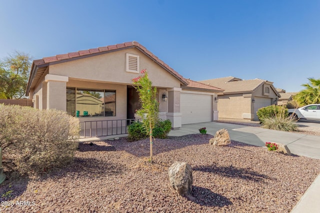 ranch-style house with driveway, an attached garage, a tile roof, and stucco siding