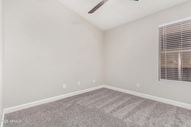 unfurnished room featuring carpet, ceiling fan, and baseboards