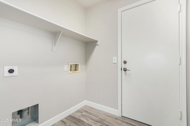 washroom with hookup for a washing machine, laundry area, baseboards, light wood finished floors, and electric dryer hookup