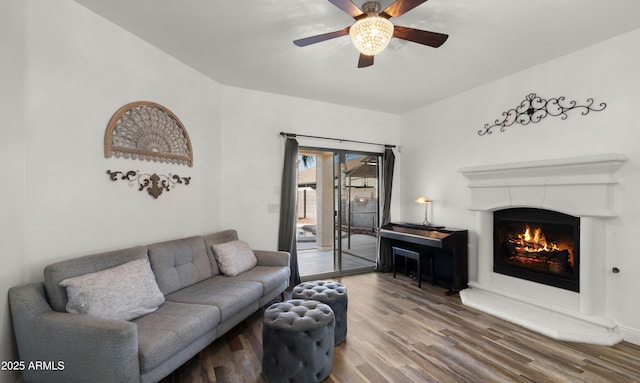 living room featuring hardwood / wood-style flooring and ceiling fan