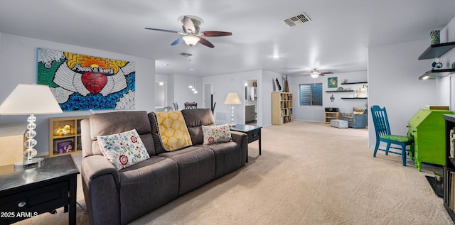 living room featuring ceiling fan and light colored carpet