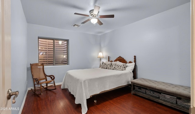 bedroom with dark hardwood / wood-style floors and ceiling fan