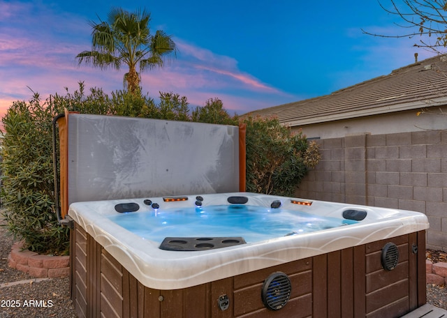 exterior space featuring a hot tub