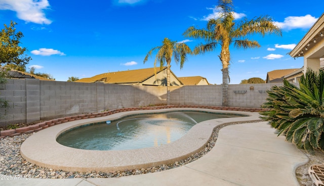 view of swimming pool with a patio area