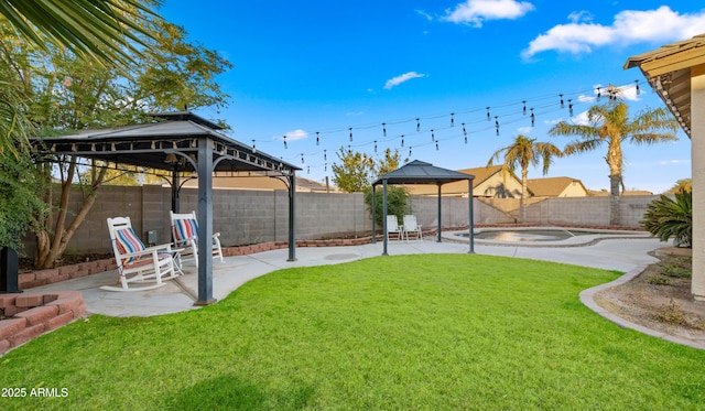 view of yard with a gazebo, a patio, and a jacuzzi