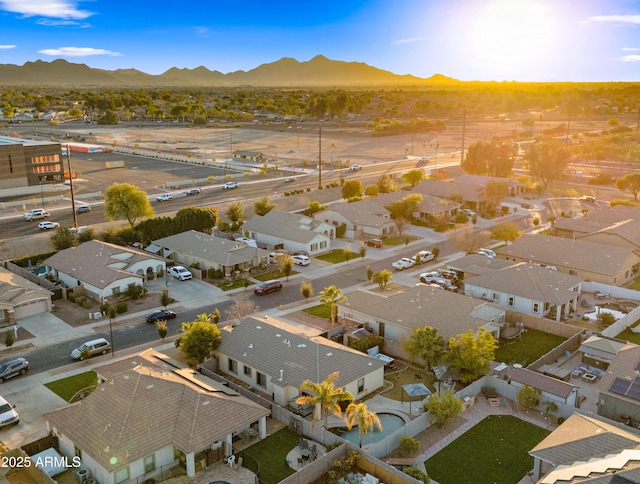 birds eye view of property with a mountain view