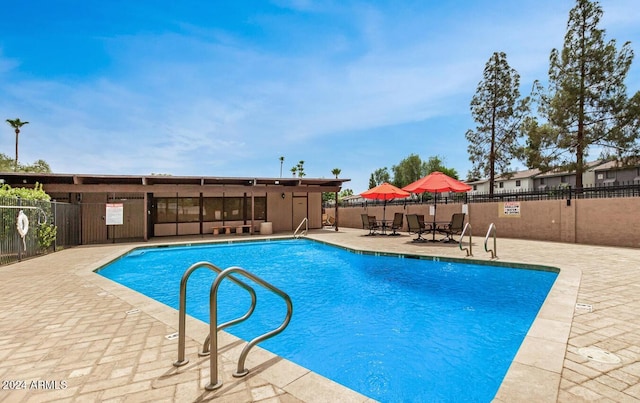 view of pool featuring a patio