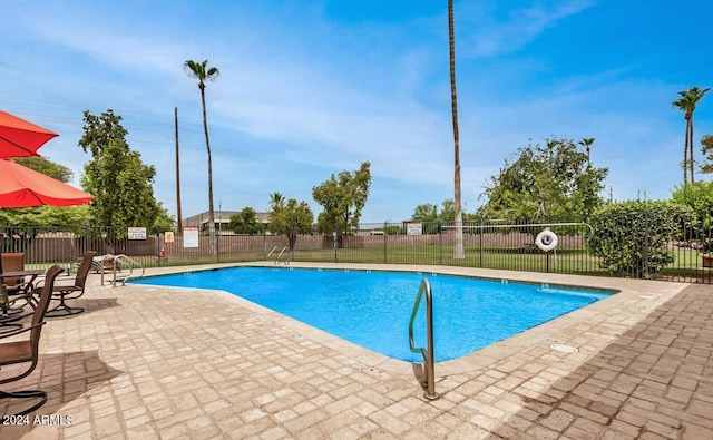 view of pool featuring a patio