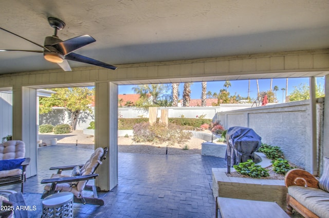 view of patio / terrace featuring ceiling fan