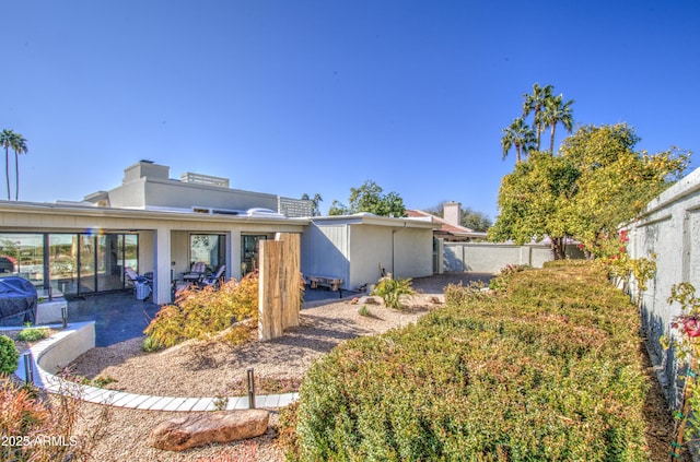 back of house with a patio area