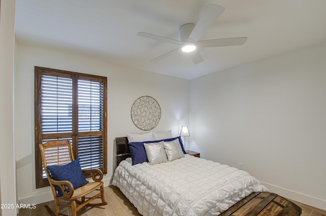 bedroom featuring light hardwood / wood-style floors and ceiling fan