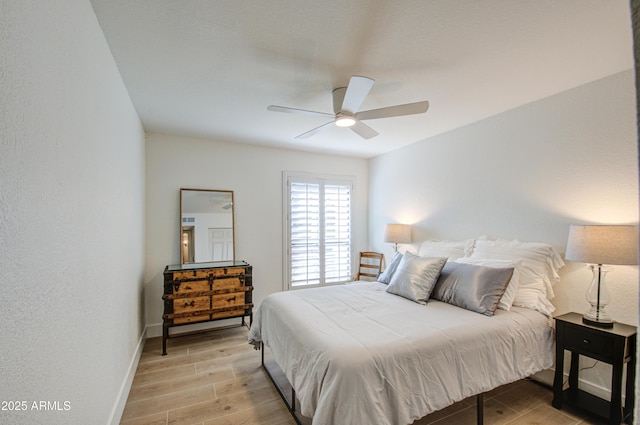 bedroom featuring ceiling fan and light wood-type flooring
