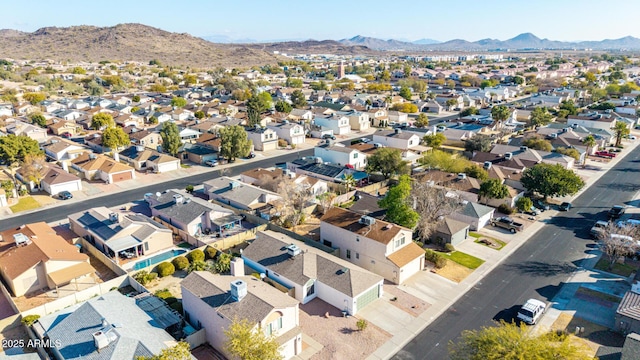 birds eye view of property featuring a mountain view