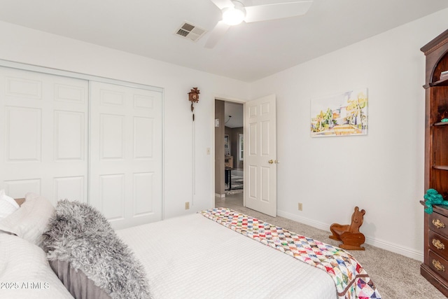 carpeted bedroom with a closet and ceiling fan