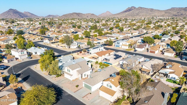 birds eye view of property with a mountain view