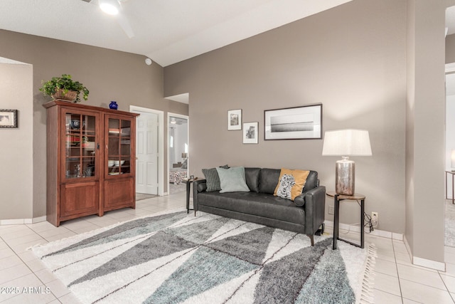 tiled living room with vaulted ceiling