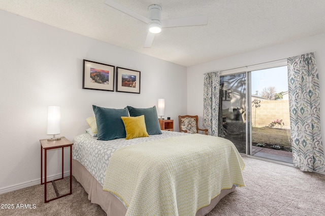 bedroom featuring ceiling fan, a textured ceiling, light carpet, and access to outside