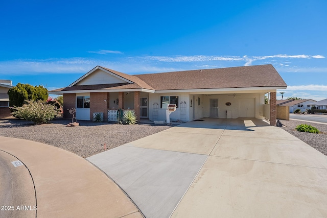 ranch-style home featuring a carport