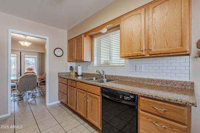 kitchen featuring dishwasher, sink, backsplash, light tile patterned floors, and light stone countertops