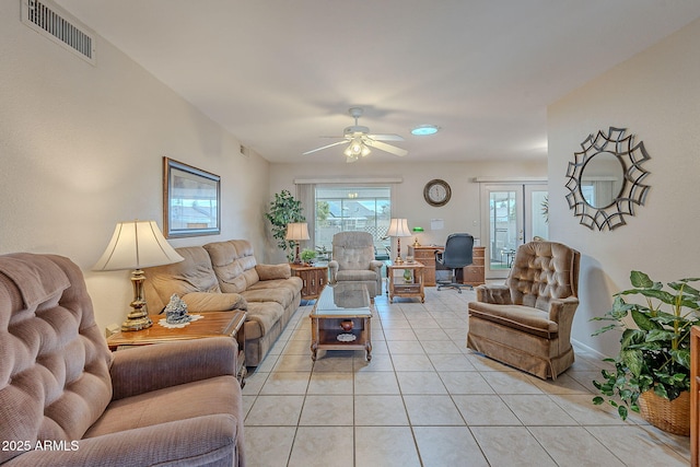 living room with light tile patterned floors and ceiling fan