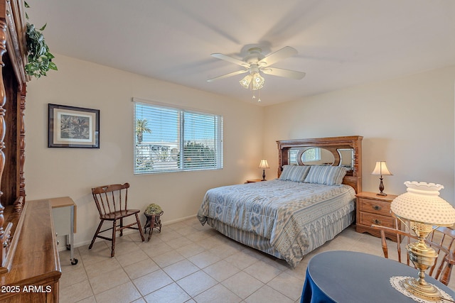 tiled bedroom featuring ceiling fan