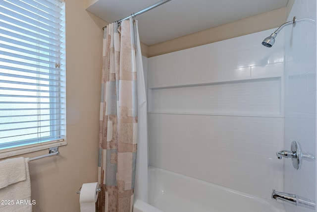 bathroom featuring shower / bath combo with shower curtain