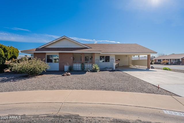 single story home featuring a carport and covered porch