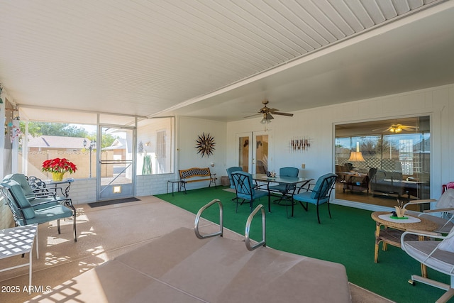 sunroom / solarium with ceiling fan