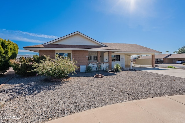 ranch-style home featuring a carport