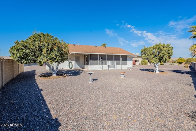 back of property featuring a sunroom