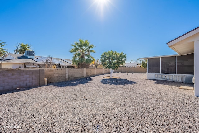 view of yard featuring a sunroom