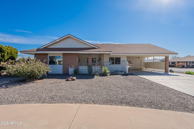 single story home featuring a carport