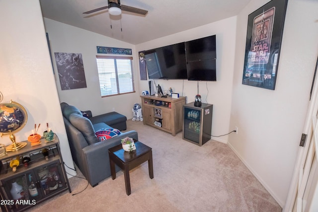 carpeted living room with lofted ceiling and ceiling fan