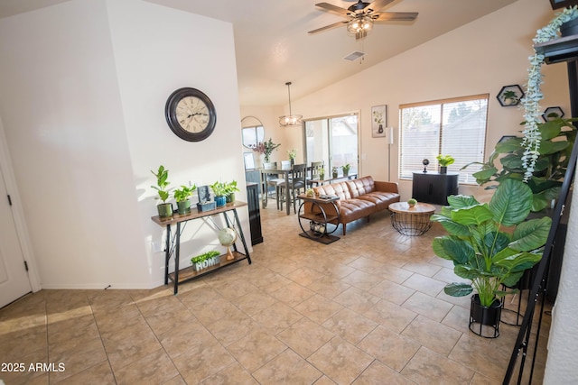 living room featuring light tile patterned floors, vaulted ceiling, and ceiling fan