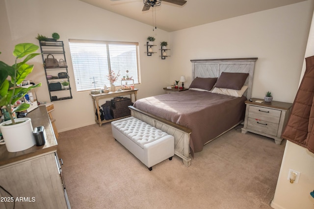 carpeted bedroom with vaulted ceiling and ceiling fan