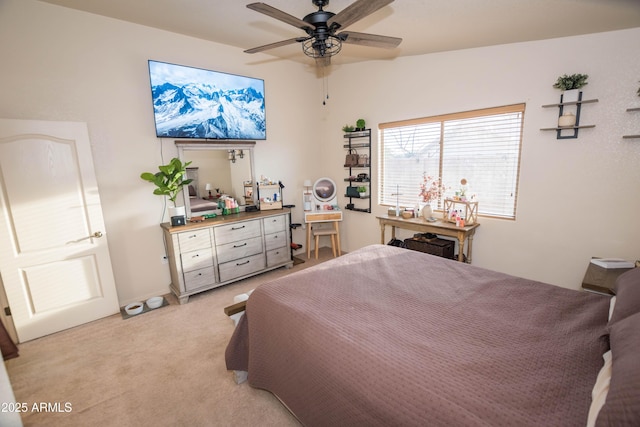 bedroom featuring light carpet and ceiling fan