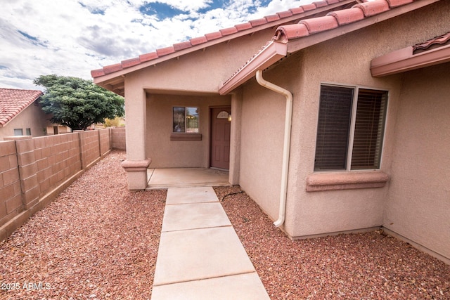 entrance to property with a patio area