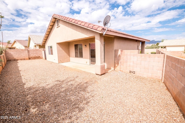 back of property with a patio area