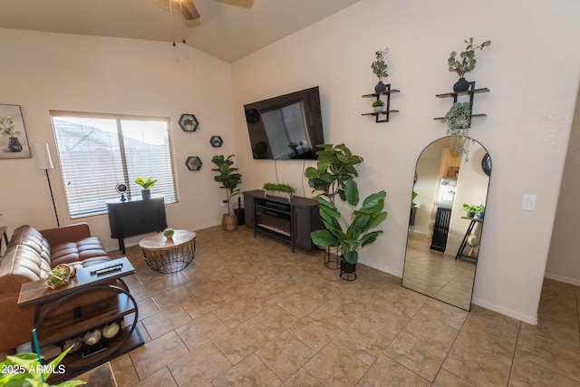 living room featuring lofted ceiling and ceiling fan