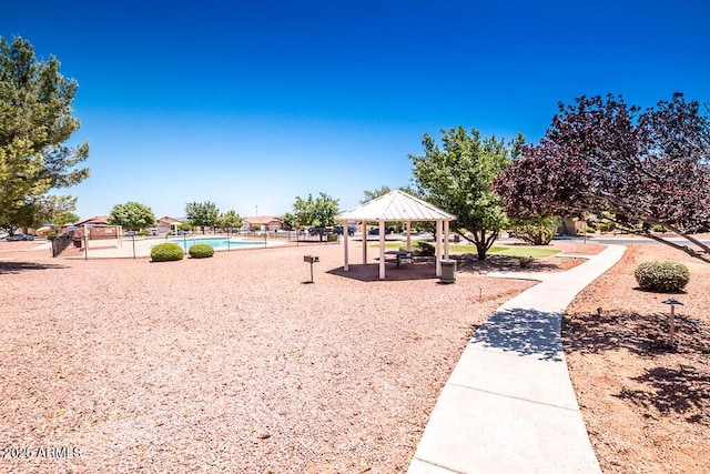 view of community featuring a gazebo and a swimming pool