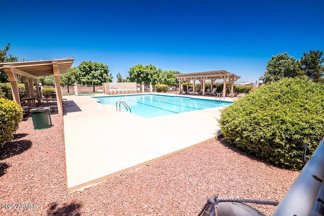 view of swimming pool with a pergola and a patio