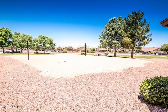 view of home's community featuring volleyball court