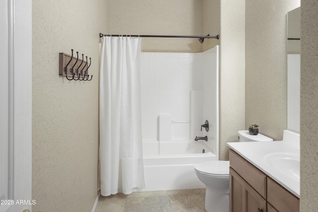 full bathroom featuring toilet, shower / bath combo with shower curtain, and vanity