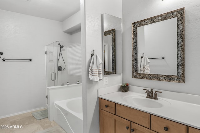 bathroom featuring a garden tub, a shower stall, and vanity