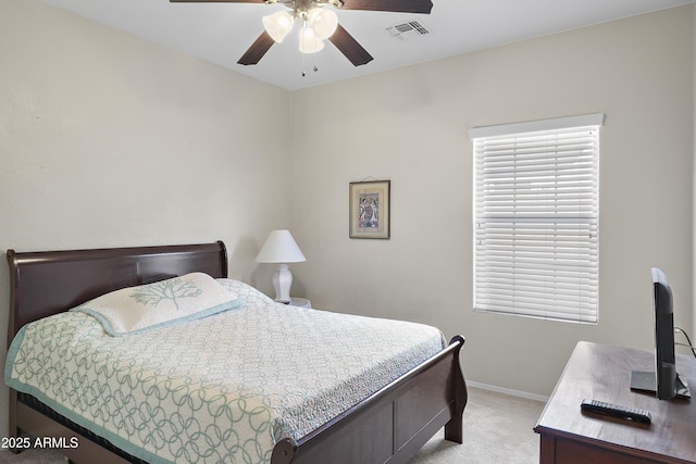 bedroom featuring light colored carpet, visible vents, ceiling fan, and baseboards