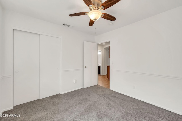 8009 W Salter Dr, Peoria, AZ 85382 - unfurnished bedroom featuring carpet, a closet, ceiling fan, and baseboards